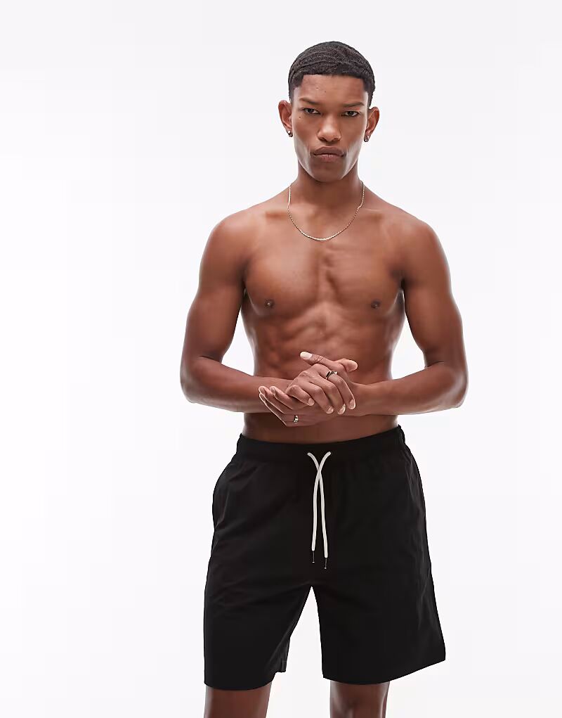 Шорты для плавания ARKET средней длины с завязками черного цвета
Шорты для плавания ARKET средней длины с завязками черного цвета