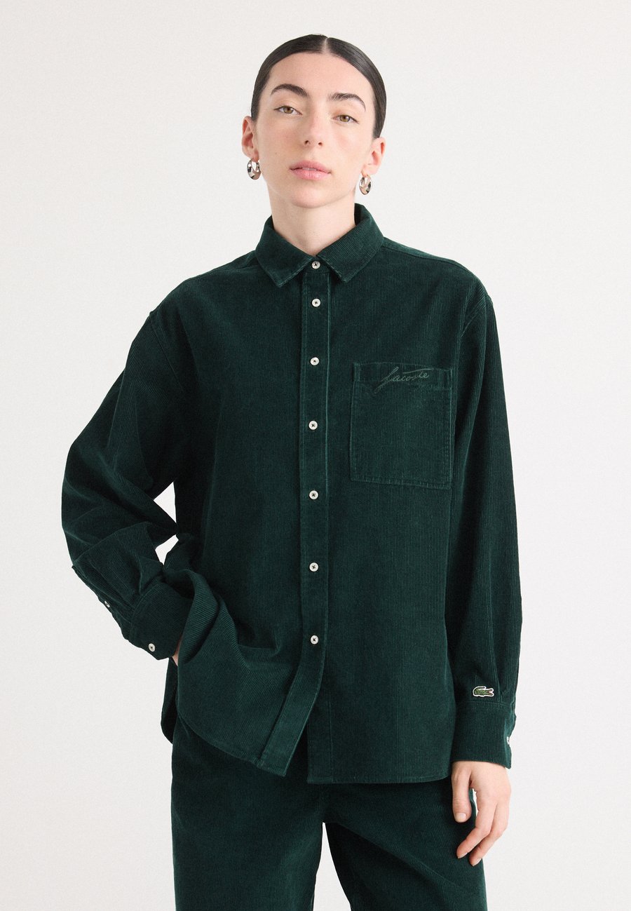 Блуза Lacoste Button-down blouse, Sinople/Dark Green
Блуза Lacoste Button-down blouse, Sinople/Dark Green