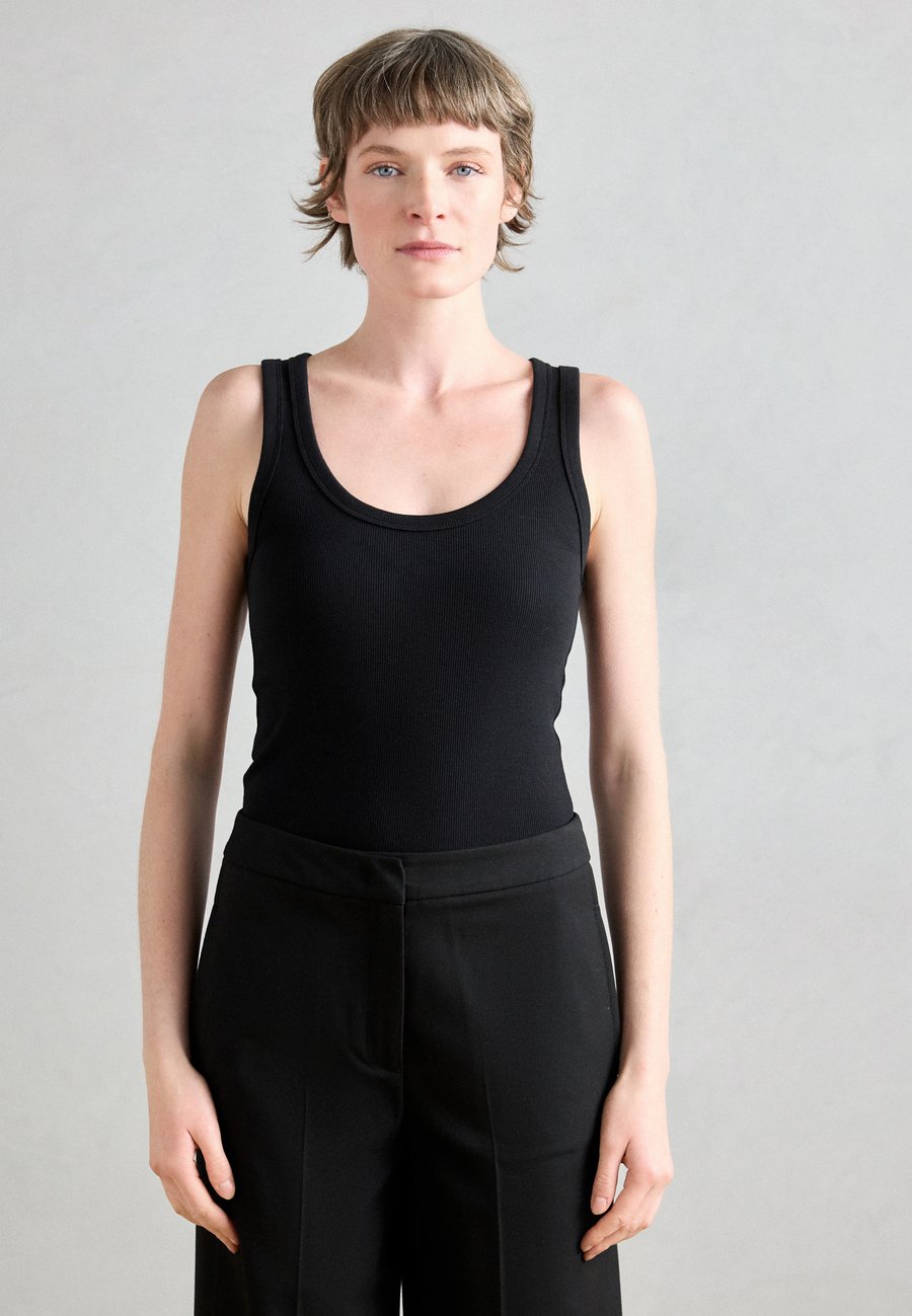 Топ Marc O'Polo DEEP ROUND NECK, Black
Топ Marc O'Polo DEEP ROUND NECK, Black