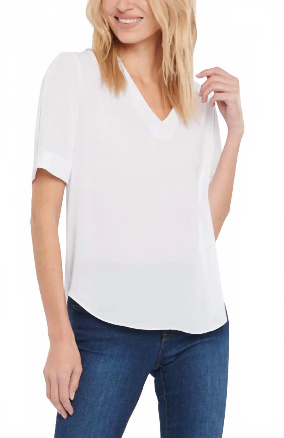 Очаровательный топ белого цвета NYDJ
Очаровательный топ белого цвета NYDJ