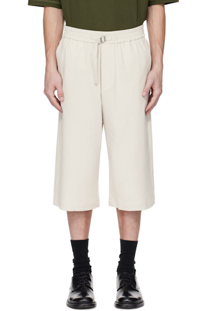 Серые эластичные шорты большого размера AMI Paris
Серые эластичные шорты большого размера AMI Paris