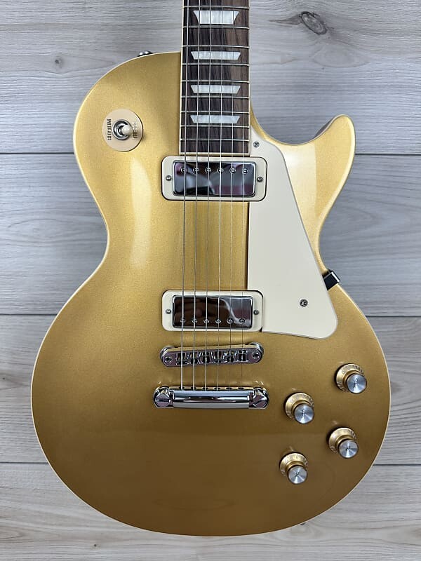 Электрогитара Gibson Les Paul Deluxe 70s Electric Guitar - Goldtop
Электрогитара Gibson Les Paul Deluxe 70s Electric Guitar - Goldtop