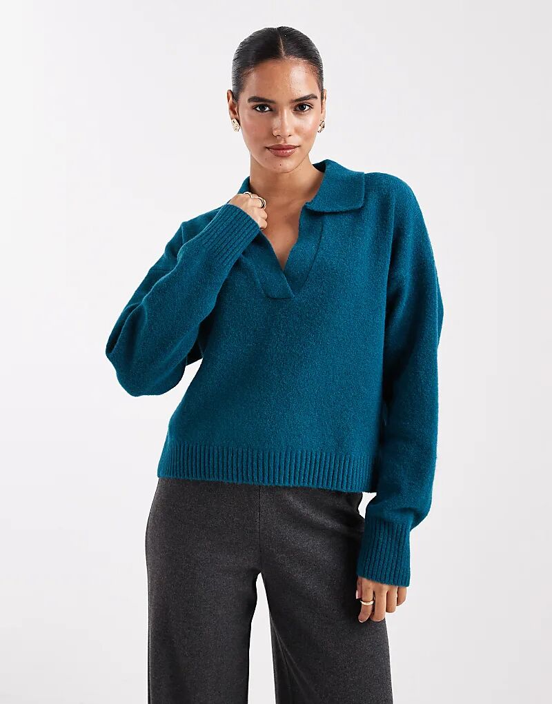 Вязаный джемпер Monki с длинными рукавами и воротником-поло в бирюзовом цвете
Вязаный джемпер Monki с длинными рукавами и воротником-поло в бирюзовом цвете