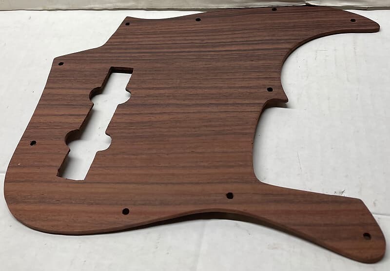 Накладка из восточно-индийского палисандра, 10 отверстий, накладка для бас-гитары, пластина для джазовой бас-гитары, пластина с 10 отверстиями Fender For single-coil Jazz Bass pickup 10-Hole Pickguard
Накладка из восточно-индийского палисандра, 10 отверстий, накладка для бас-гитары, пластина для джазовой бас-гитары, пластина с 10 отверстиями Fender For single-coil Jazz Bass pickup 10-Hole Pickguard