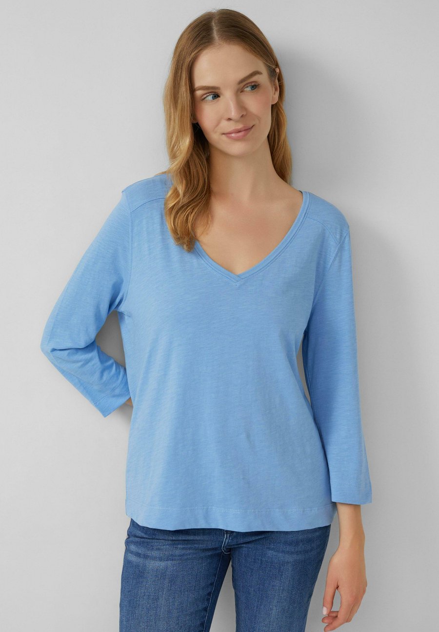 Топ s.Oliver 3/4-ARM MIT TIEFEM V-AUSSCHNITT, Hellblau/Light Blue
Топ s.Oliver 3/4-ARM MIT TIEFEM V-AUSSCHNITT, Hellblau/Light Blue