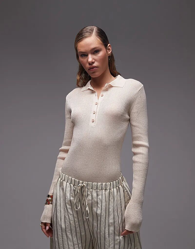 Боди-поло ASOS DESIGN из трикотажного полотна с пуговицами спереди цвета экрю
Боди-поло ASOS DESIGN из трикотажного полотна с пуговицами спереди цвета экрю