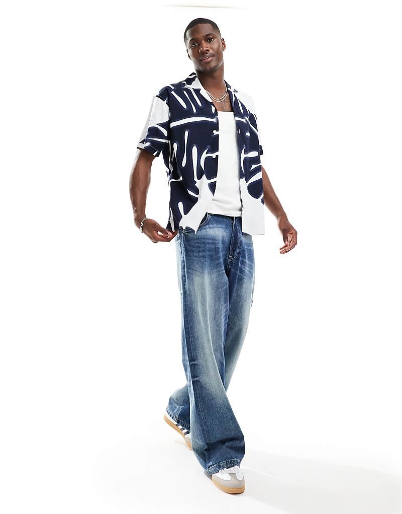 Темно-синяя хлопковая рубашка с абстрактным принтом Jack & Jones Premium Premium
Темно-синяя хлопковая рубашка с абстрактным принтом Jack & Jones Premium Premium