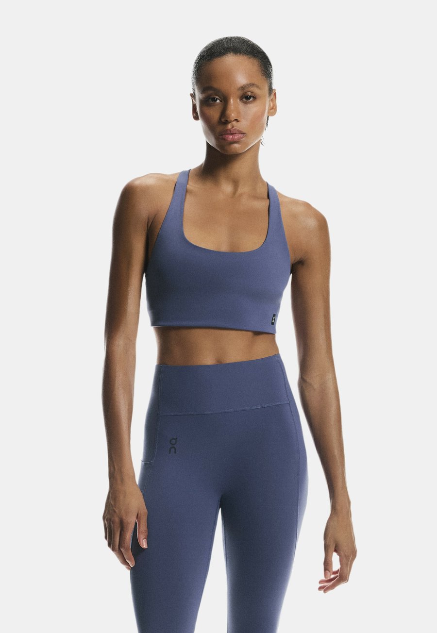 Бюстгальтер On Light support sports bra, Acai/Mottled Blue
Бюстгальтер On Light support sports bra, Acai/Mottled Blue