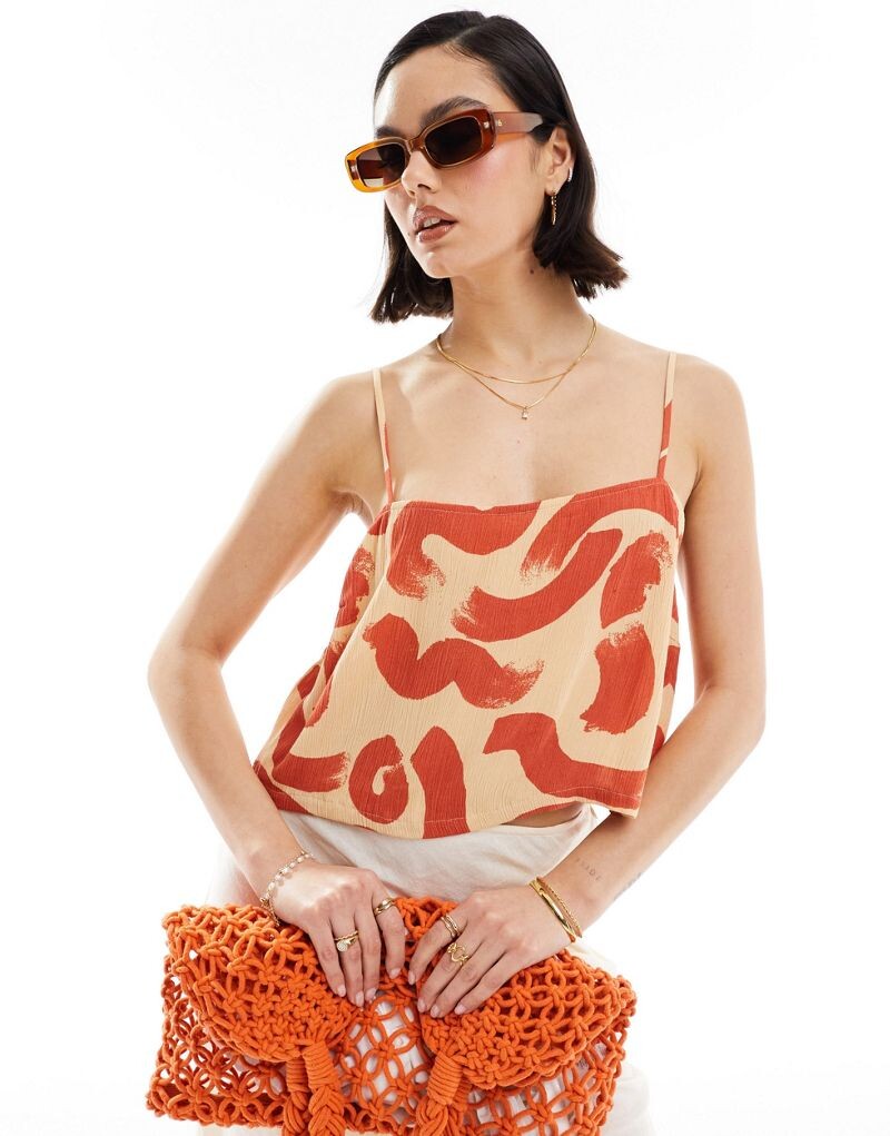 Оранжевая майка ASOS DESIGN с абстрактным принтом и мятой квадратной горловиной с эффектом льна
Оранжевая майка ASOS DESIGN с абстрактным принтом и мятой квадратной горловиной с эффектом льна