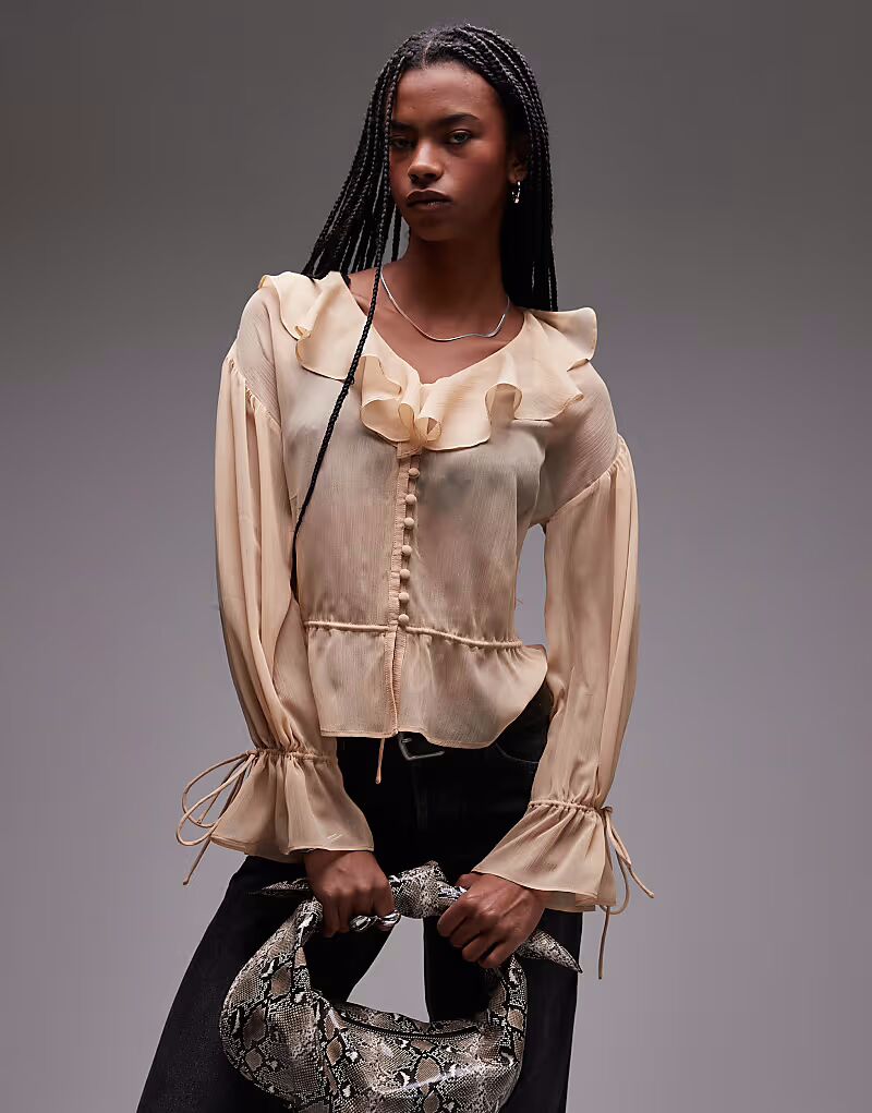 Прозрачный топ Topshop бежевого цвета с оборками и завязкой спереди
Прозрачный топ Topshop бежевого цвета с оборками и завязкой спереди