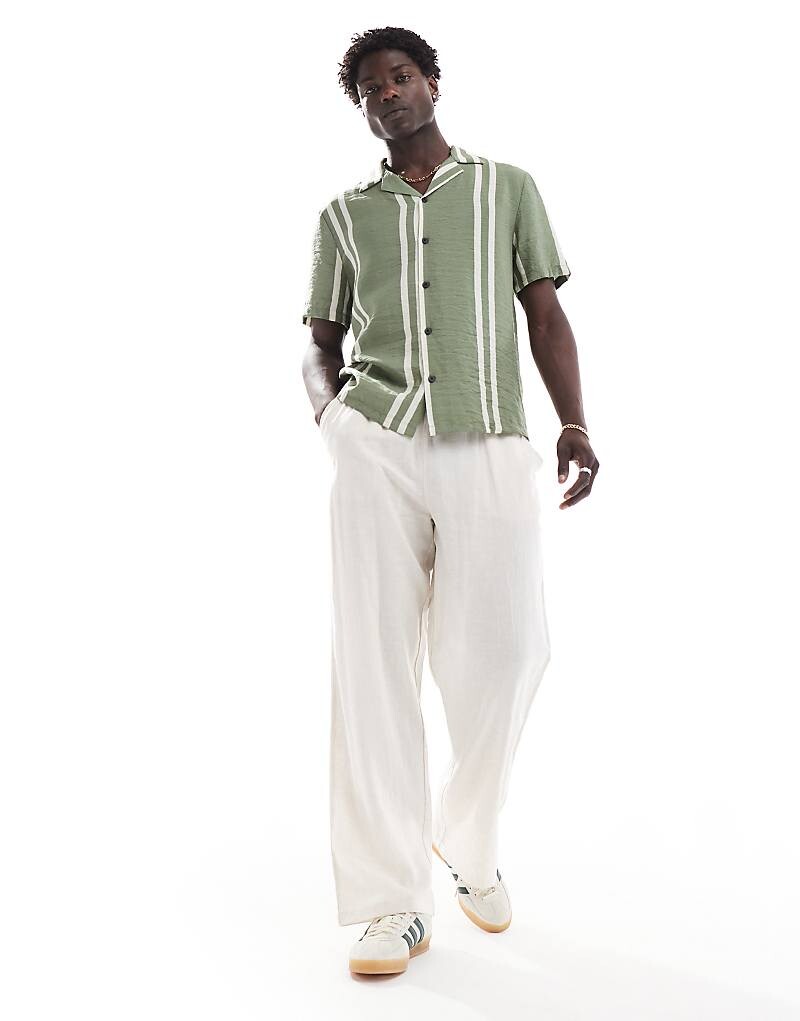 River Island – Рубашка с кубинским воротником в зеленую полоску
River Island – Рубашка с кубинским воротником в зеленую полоску