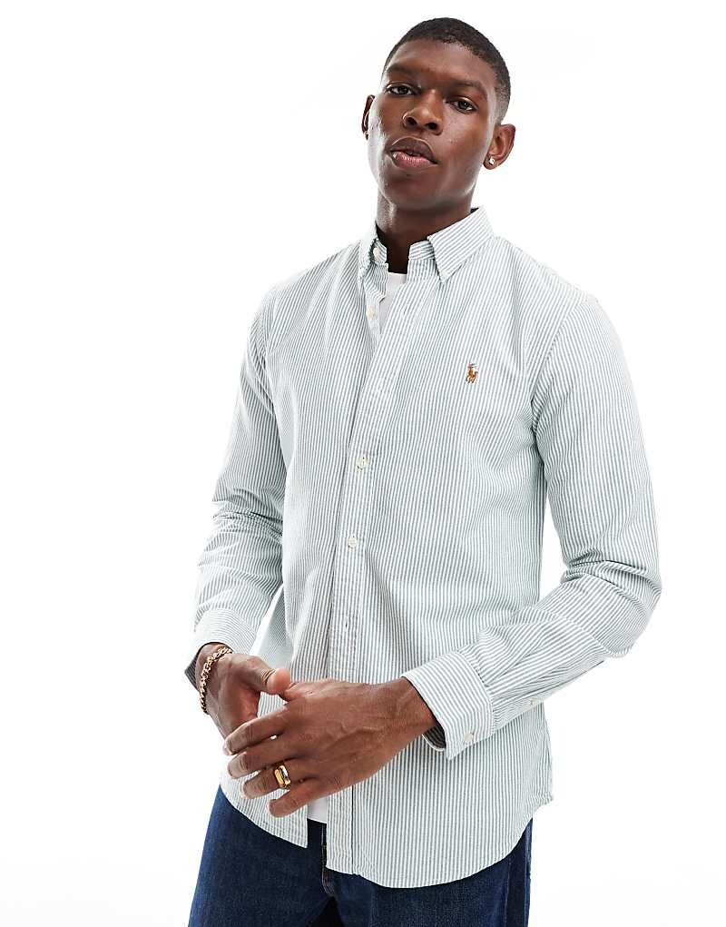 Polo Ralph Lauren – темно-зелено-белая приталенная оксфордская рубашка в полоску с логотипом
Polo Ralph Lauren – темно-зелено-белая приталенная оксфордская рубашка в полоску с логотипом