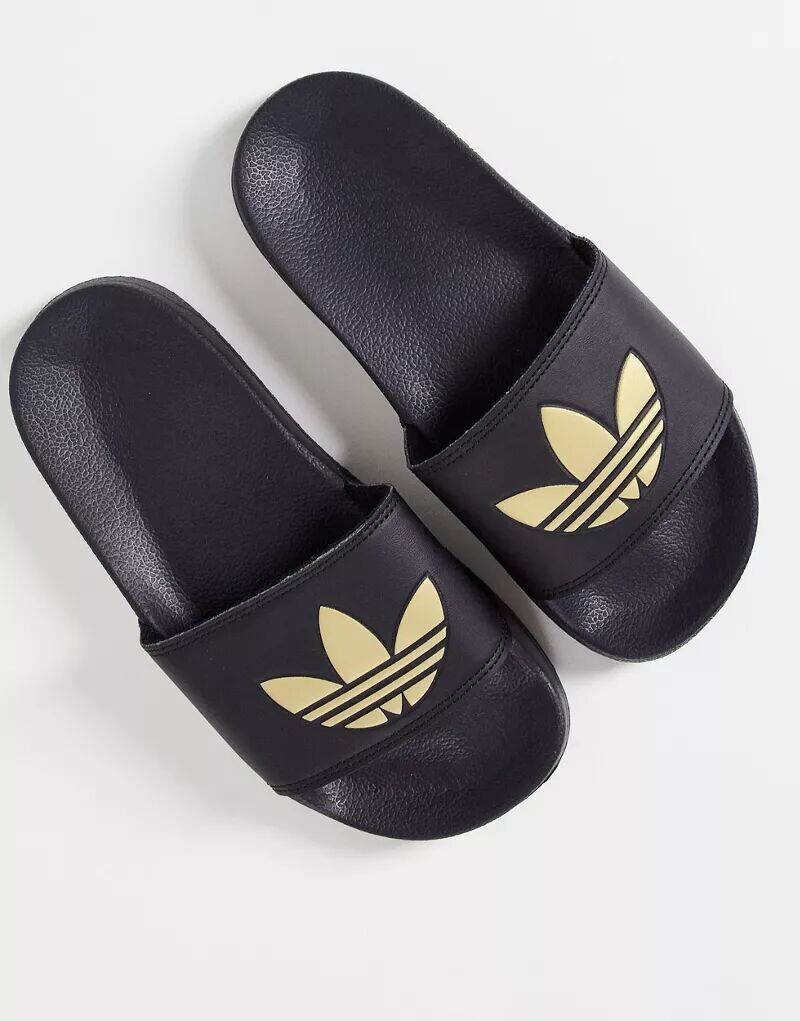 Черные сандалии с логотипом в виде трилистника adidas Originals Adilette Lite Lite
Черные сандалии с логотипом в виде трилистника adidas Originals Adilette Lite Lite