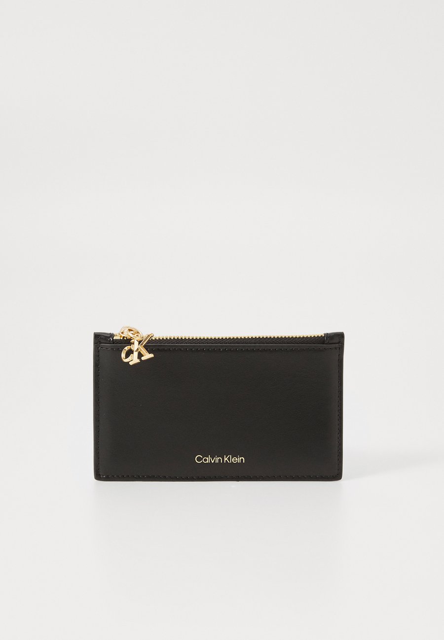 Кошелек Calvin Klein ZIP CARDCASE , Black
Кошелек Calvin Klein ZIP CARDCASE , Black