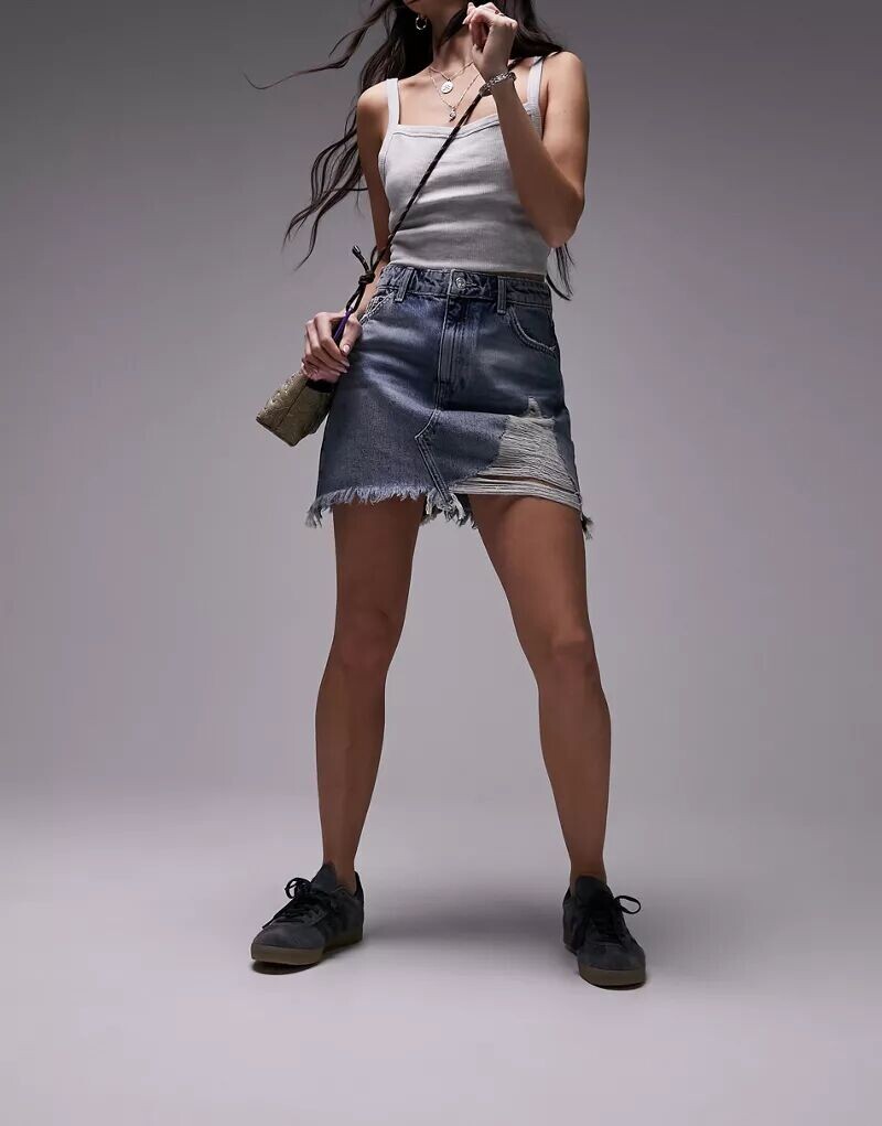 Джинсовая юбка Topshop средне-синего цвета с завышенной талией и яркими декоративными разрывами
Джинсовая юбка Topshop средне-синего цвета с завышенной талией и яркими декоративными разрывами