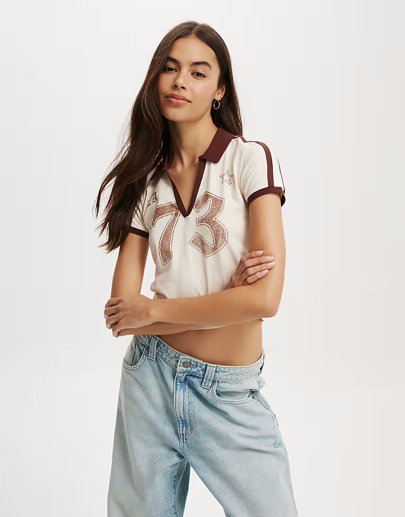 Футболка-поло с принтом «ретро» из хлопка: многоцветная Cotton:On
Футболка-поло с принтом «ретро» из хлопка: многоцветная Cotton:On