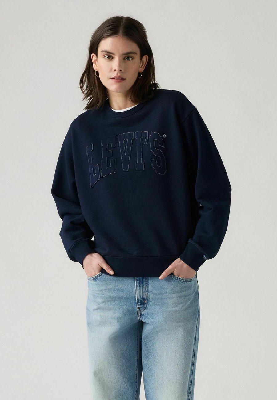 Толстовка Levi's GRAPHIC HERITAGE CREW EAGLE, Levis Raw Edge Appl/Blue Denim
Толстовка Levi's GRAPHIC HERITAGE CREW EAGLE, Levis Raw Edge Appl/Blue Denim