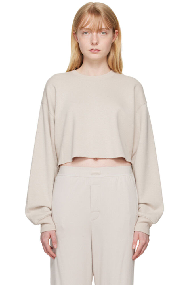 Укороченная толстовка из хлопкового флиса цвета тауп SKIMS
Укороченная толстовка из хлопкового флиса цвета тауп SKIMS