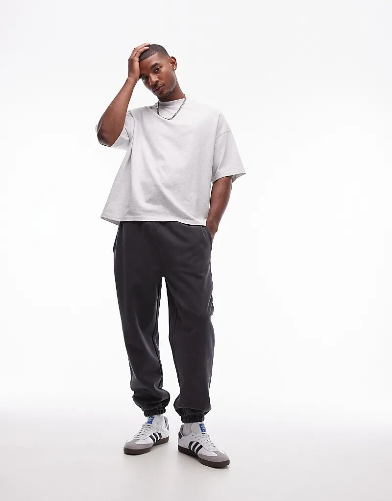 Постиранные свободные джоггеры черного цвета Topman
Постиранные свободные джоггеры черного цвета Topman