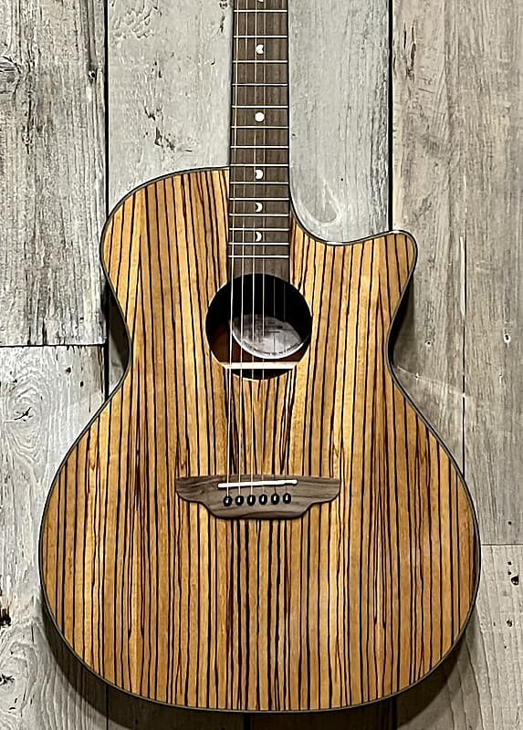 Акустическая гитара Luna Gypsy Series Exotic Gypsy ZEBRAWOOD A/E - GLOSS NATURAL, Support Small Business & buy It Here ! 
Акустическая гитара Luna Gypsy Series Exotic Gypsy ZEBRAWOOD A/E - GLOSS NATURAL, Support Small Business & buy It Here !