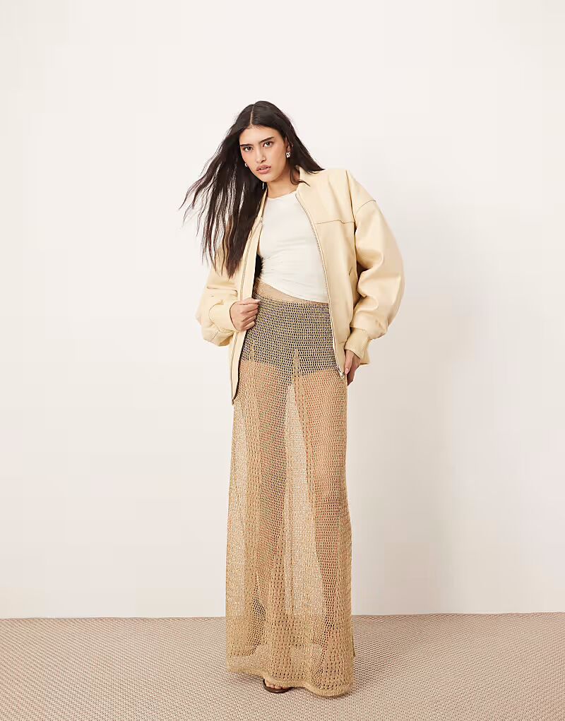 ARRANGE металлизированная трикотажная прозрачная длинная юбка золотого цвета
ARRANGE металлизированная трикотажная прозрачная длинная юбка золотого цвета