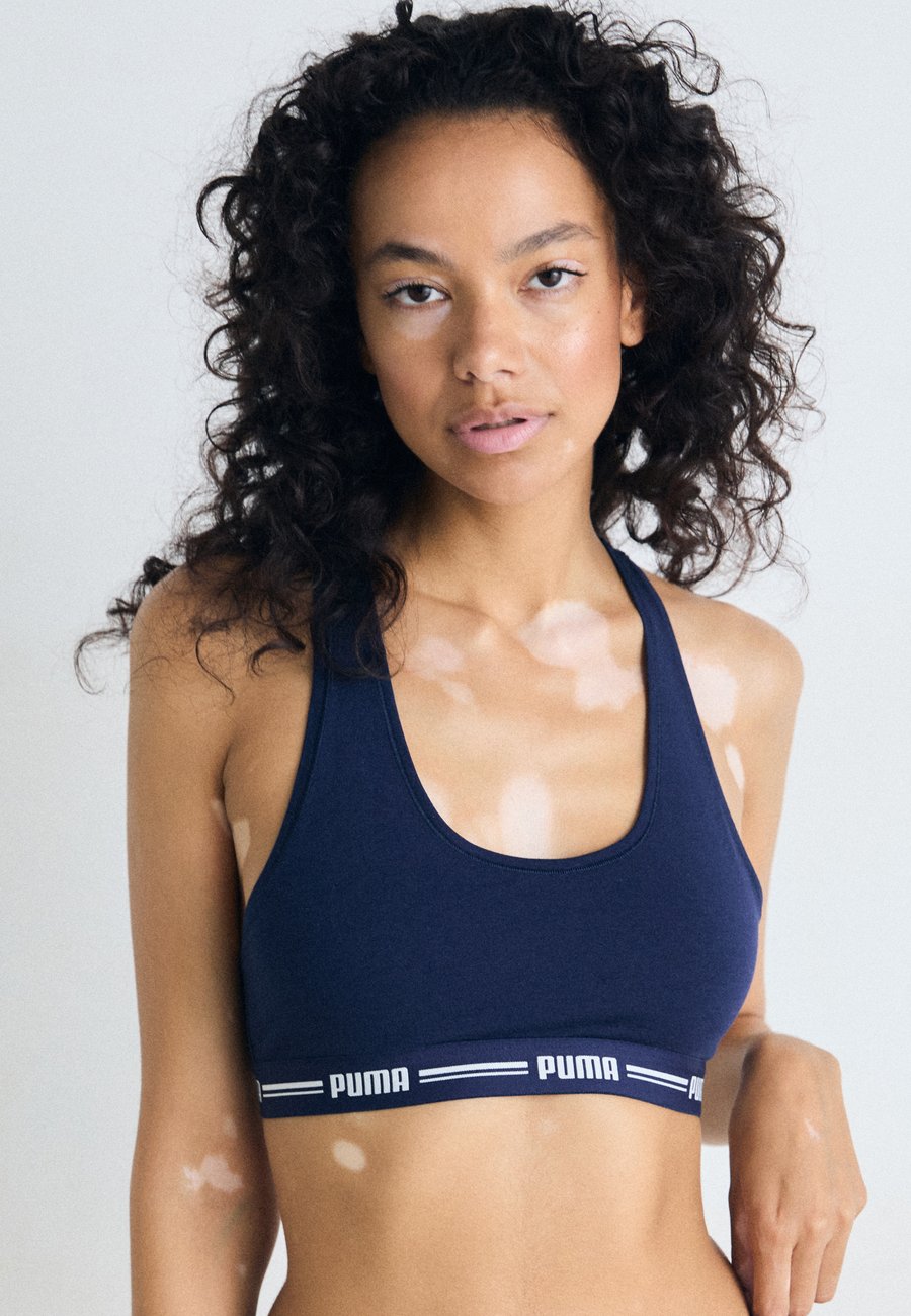 Бюстье Puma WOMEN RACER BACK HANG, Navy/Dark Blue
Бюстье Puma WOMEN RACER BACK HANG, Navy/Dark Blue