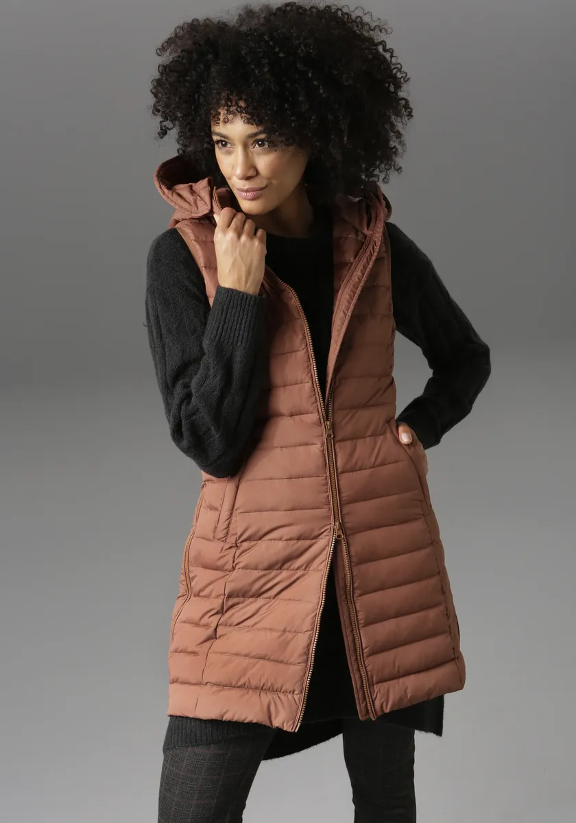 Стеганый жилет Aniston CASUAL с регулируемым капюшоном, цвет Zimt, Коричневый, Стеганый жилет Aniston CASUAL с регулируемым капюшоном, цвет Zimt
Стеганый жилет Aniston CASUAL с регулируемым капюшоном, цвет Zimt, Коричневый, Стеганый жилет Aniston CASUAL с регулируемым капюшоном, цвет Zimt