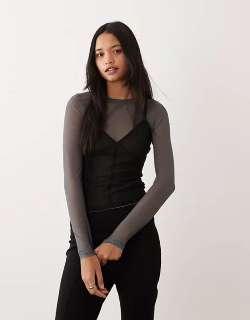 Двухслойный сетчатый топ с длинными рукавами и контрастной майкой ASOS DESIGN темно-серого цвета
Двухслойный сетчатый топ с длинными рукавами и контрастной майкой ASOS DESIGN темно-серого цвета