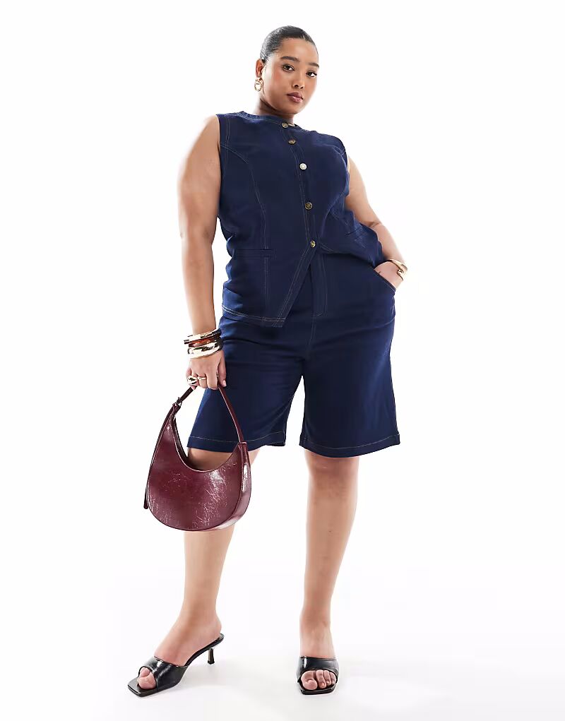 Эксклюзивные удлиненные джинсовые шорты Renee Studio Plus из темного денима
Эксклюзивные удлиненные джинсовые шорты Renee Studio Plus из темного денима