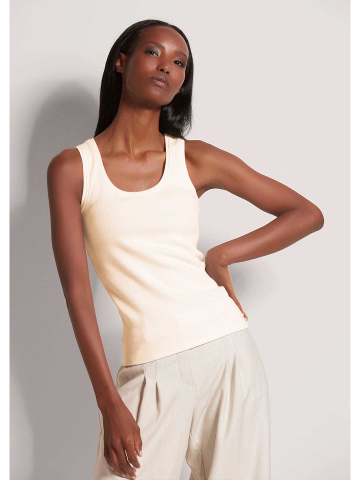 MADELEINE Топ без рукавов в рубчик жемчужно-белого цвета
MADELEINE Топ без рукавов в рубчик жемчужно-белого цвета