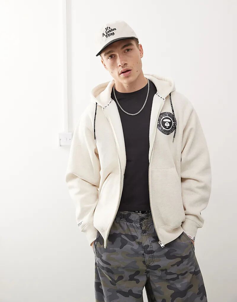 Толстовка с капюшоном на молнии с логотипом Aape by A Bathing Ape бежевого цвета
Толстовка с капюшоном на молнии с логотипом Aape by A Bathing Ape бежевого цвета