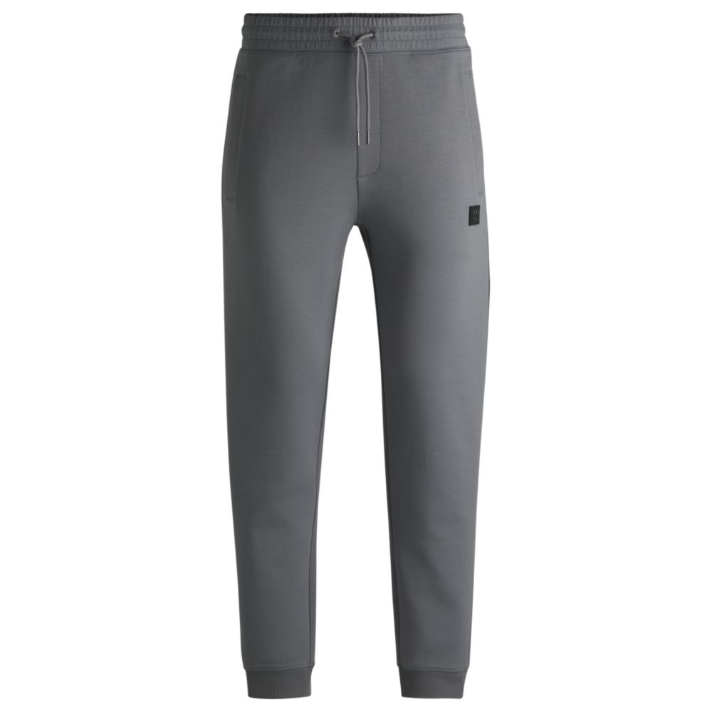 Спортивные брюки из хлопка с многослойным логотипом HUGO, светло-серый
Спортивные брюки из хлопка с многослойным логотипом HUGO, светло-серый