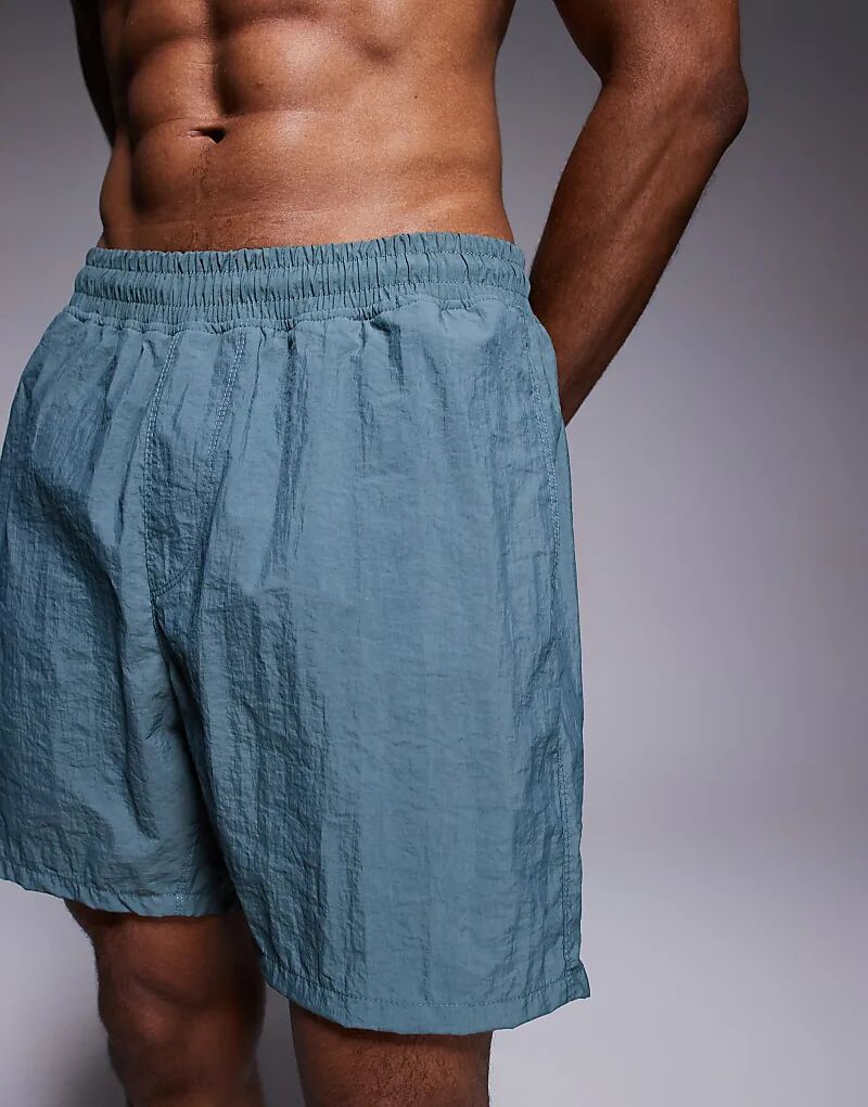 Плавки-шорты ASOS DESIGN средней длины синего цвета
Плавки-шорты ASOS DESIGN средней длины синего цвета