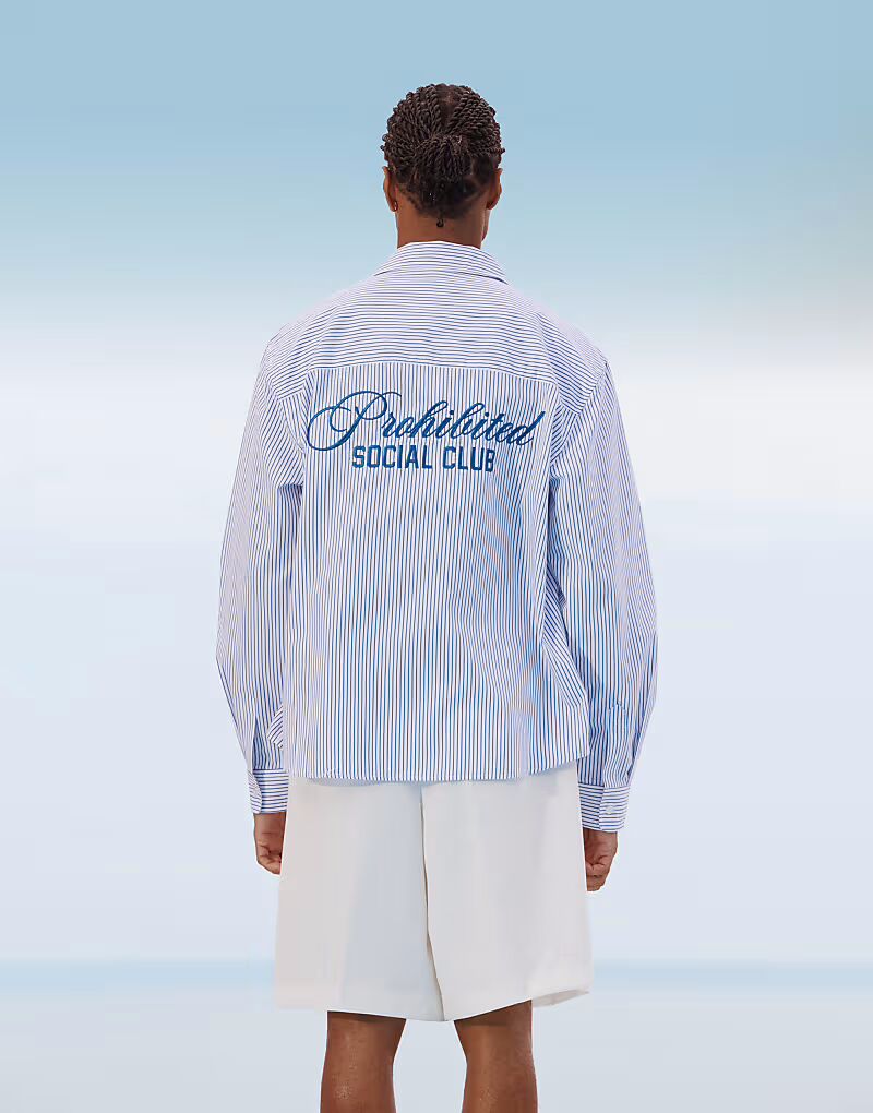 Рубашка с принтом на спине «Запрещенный социальный клуб» синего цвета
Рубашка с принтом на спине «Запрещенный социальный клуб» синего цвета