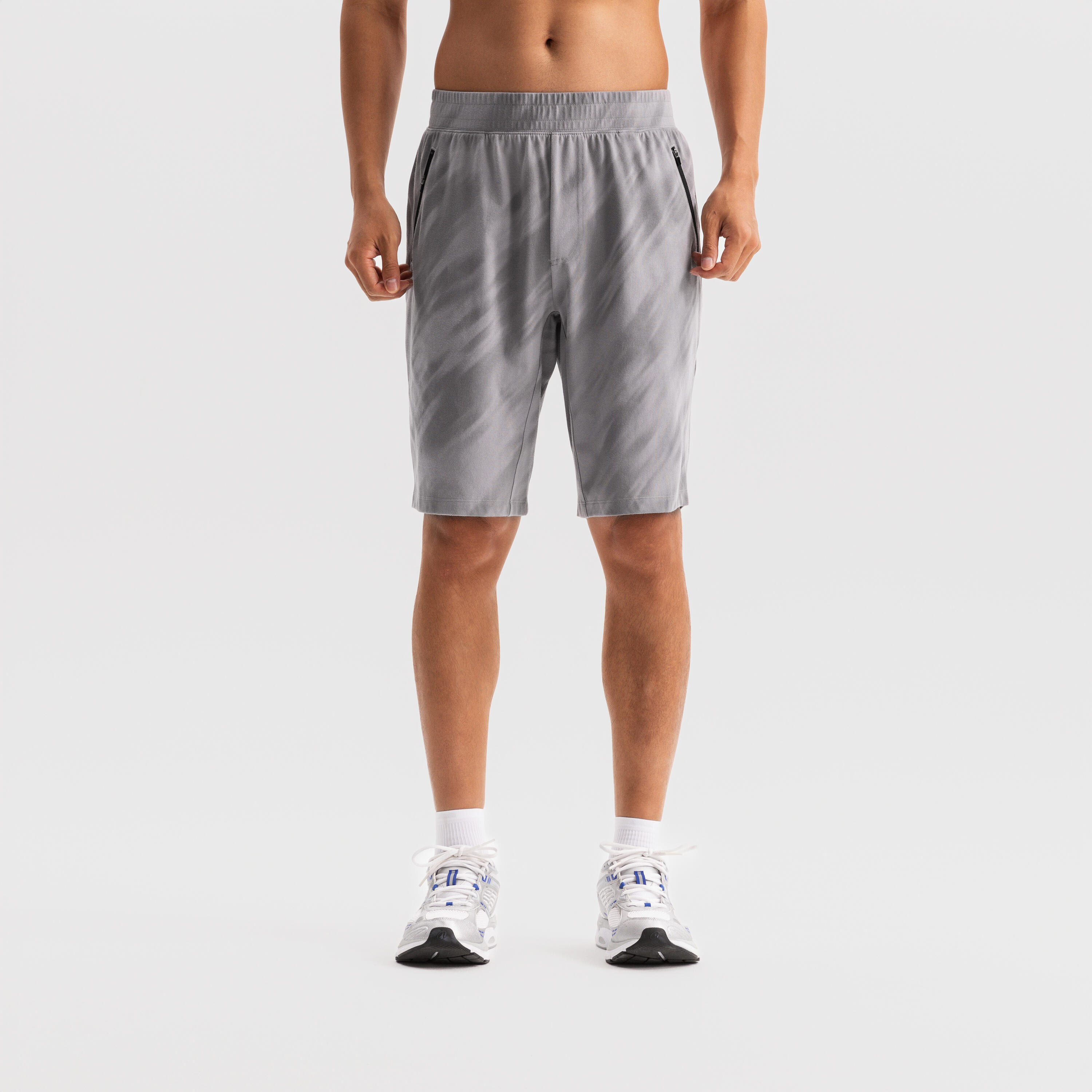 Мужские базовые спортивные шорты с молнией Domyos — светло-серые
Мужские базовые спортивные шорты с молнией Domyos — светло-серые