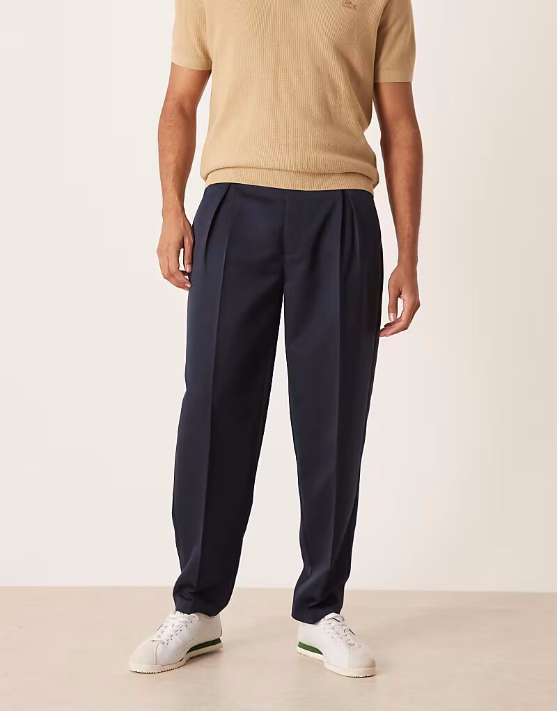 Элегантные зауженные брюки свободного кроя со складками темно-синего цвета Asos Design
Элегантные зауженные брюки свободного кроя со складками темно-синего цвета Asos Design