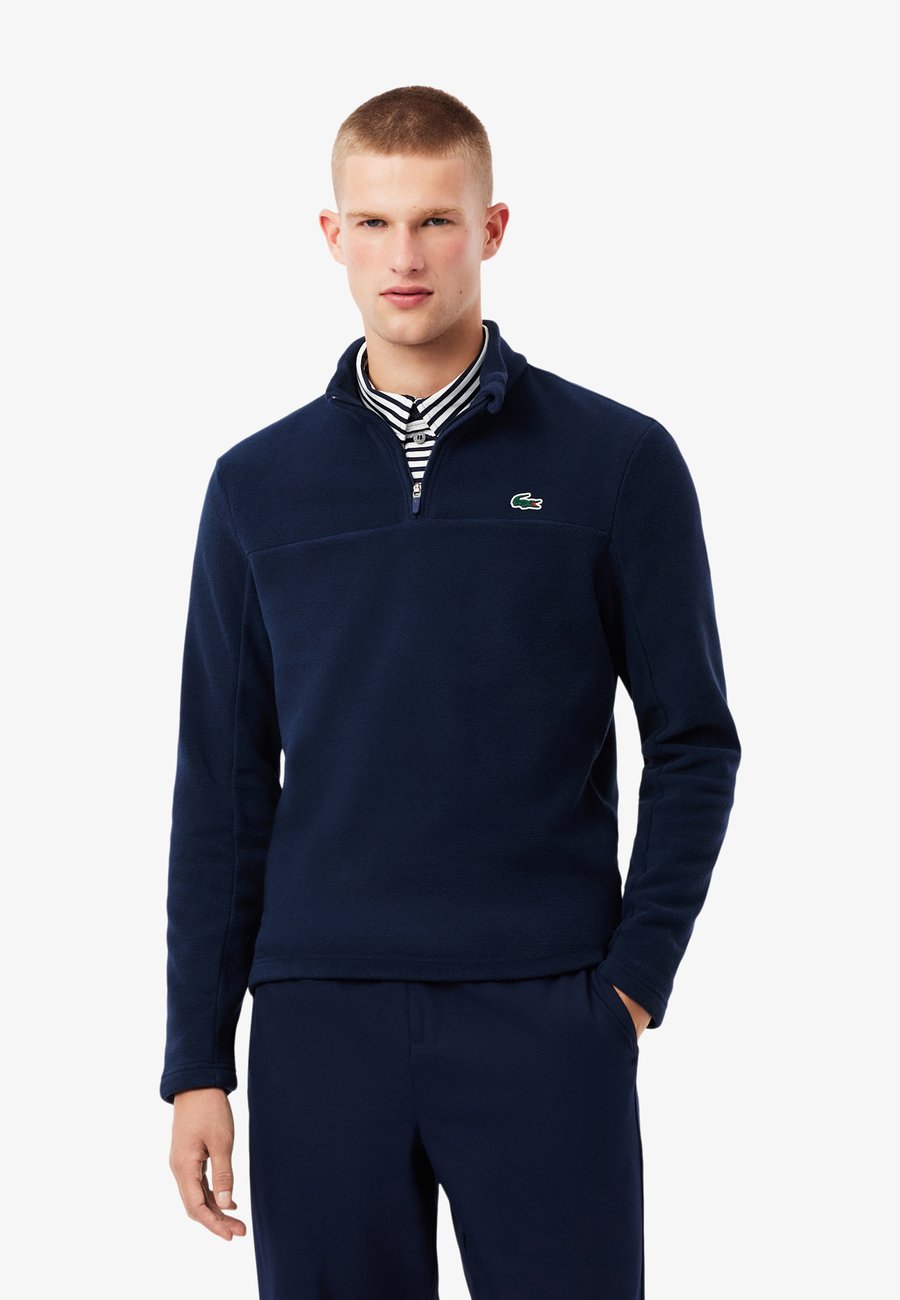Джемпер Lacoste Fleece jumper, Bleu Nuit/Blue
Джемпер Lacoste Fleece jumper, Bleu Nuit/Blue