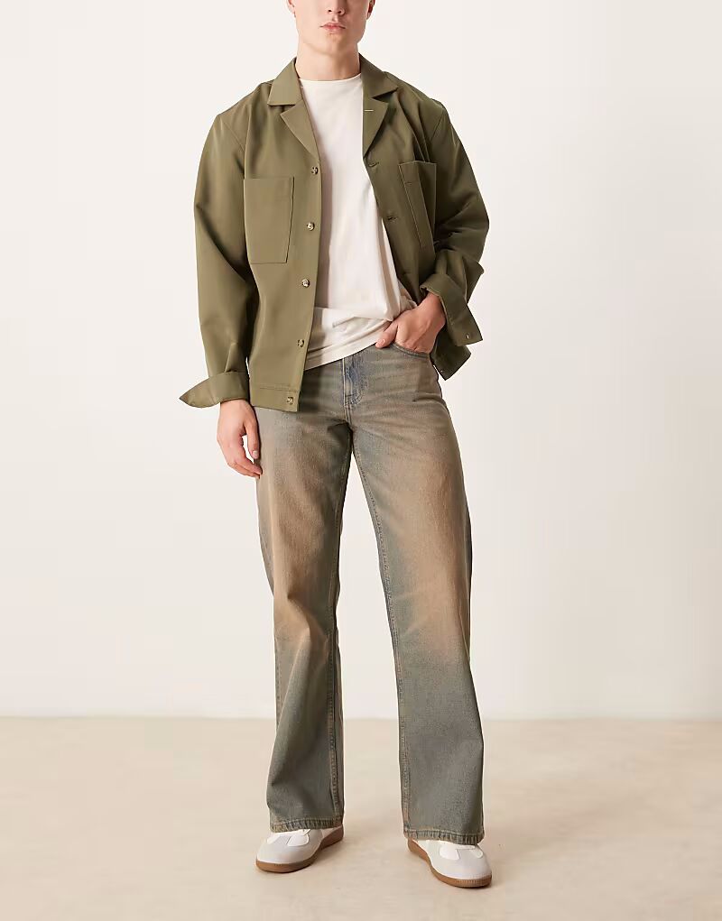 Широкие джинсы клеш ASOS DESIGN коричневого цвета с оттенком
Широкие джинсы клеш ASOS DESIGN коричневого цвета с оттенком