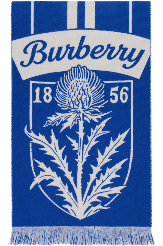 Burberry Шерстяной шарф с сине-белым рисунком в виде щита с чертополохом
Burberry Шерстяной шарф с сине-белым рисунком в виде щита с чертополохом