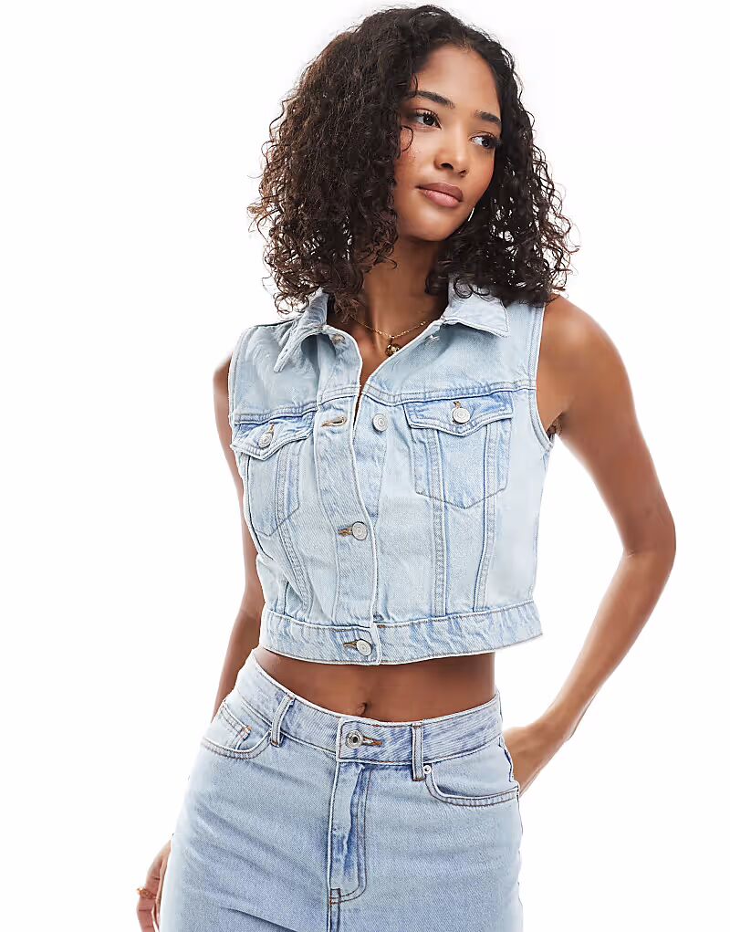 Укороченный джинсовый жилет New Look темно-синего цвета
Укороченный джинсовый жилет New Look темно-синего цвета