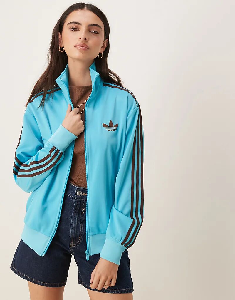 Свободный спортивный топ adidas Originals Firebird в синем и коричневом цветах
Свободный спортивный топ adidas Originals Firebird в синем и коричневом цветах