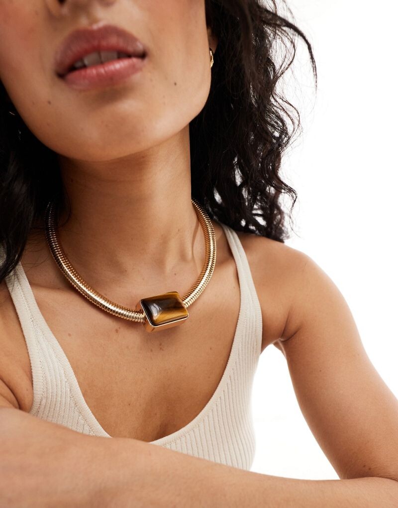 ASOS DESIGN — Золотая цепочка в форме змеи с настоящим полудрагоценным камнем «Тигровый глаз»
ASOS DESIGN — Золотая цепочка в форме змеи с настоящим полудрагоценным камнем «Тигровый глаз»