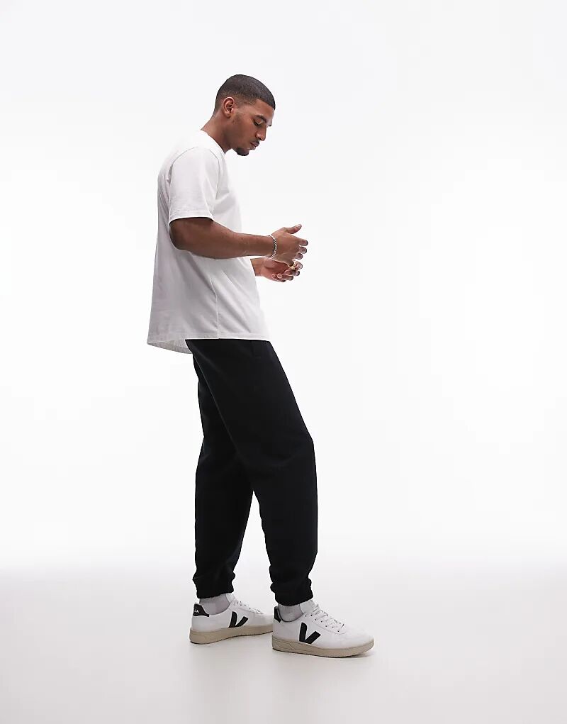 Премиальные тяжелые свободные джоггеры черного цвета Topman
Премиальные тяжелые свободные джоггеры черного цвета Topman