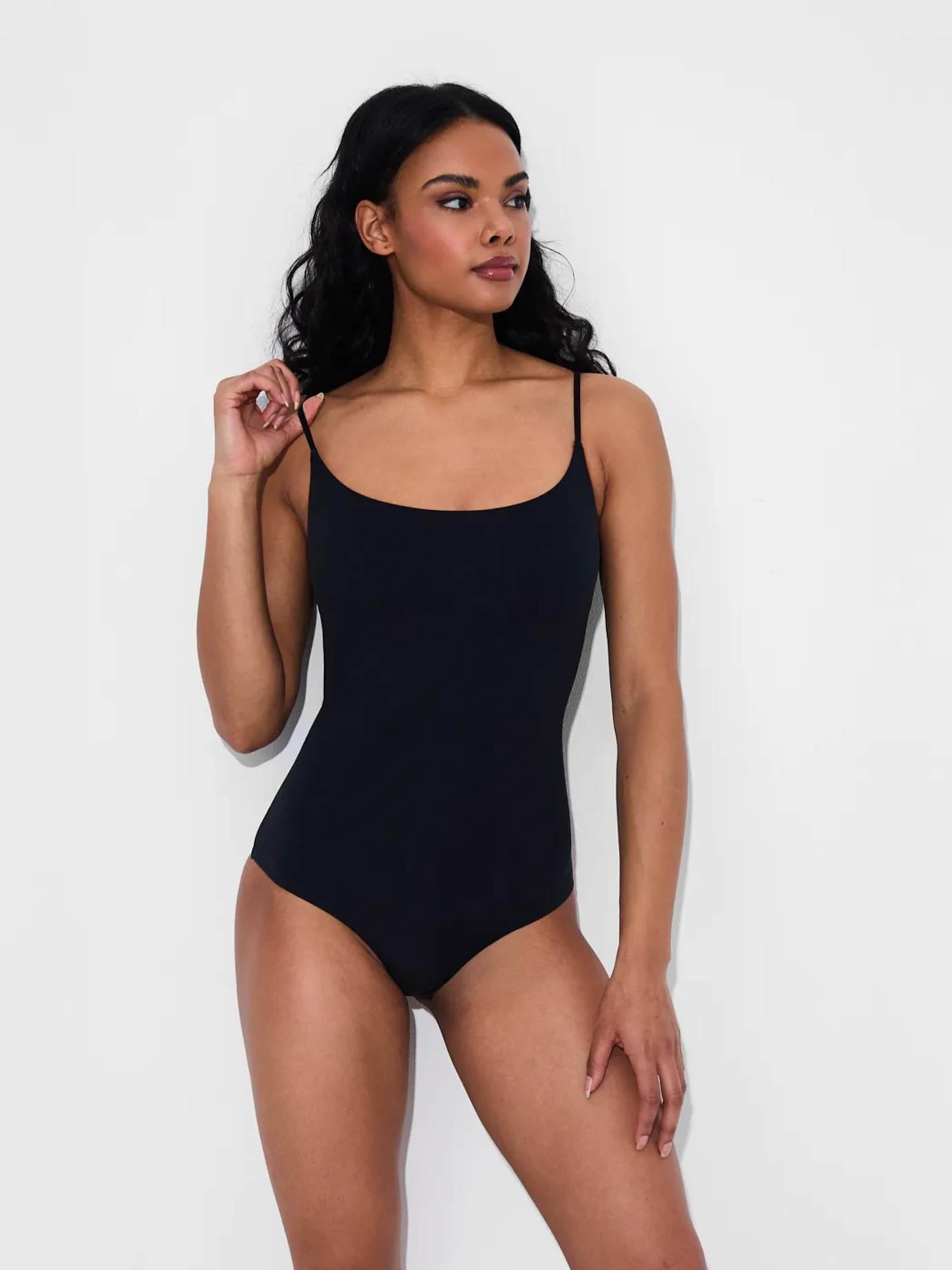 Creamy Корректирующий боди 'Cami Bodysuit mit String' в черном цвете
Creamy Корректирующий боди 'Cami Bodysuit mit String' в черном цвете