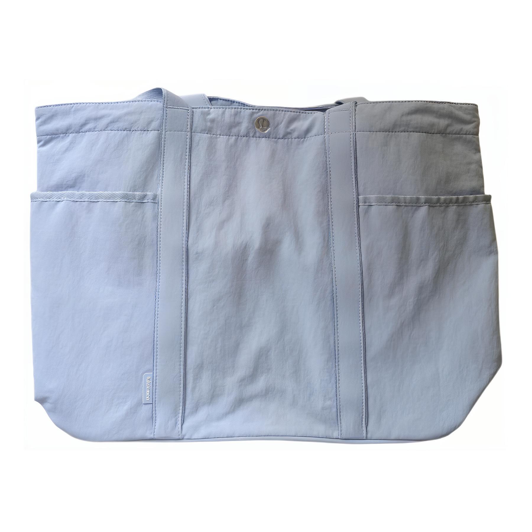 Lululemon Переработанная нейлоновая сумка-шоппер, Linen Blue
Lululemon Переработанная нейлоновая сумка-шоппер, Linen Blue