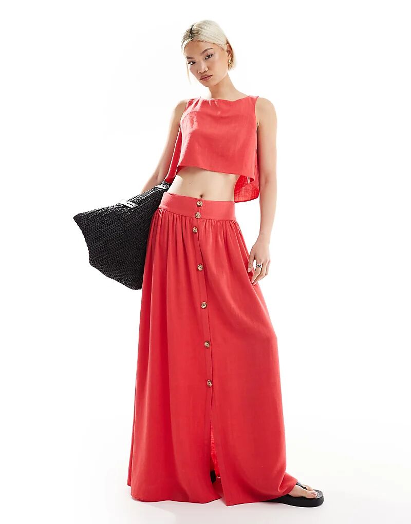Длинная льняная юбка ASOS DESIGN кораллового цвета с пуговицами спереди
Длинная льняная юбка ASOS DESIGN кораллового цвета с пуговицами спереди