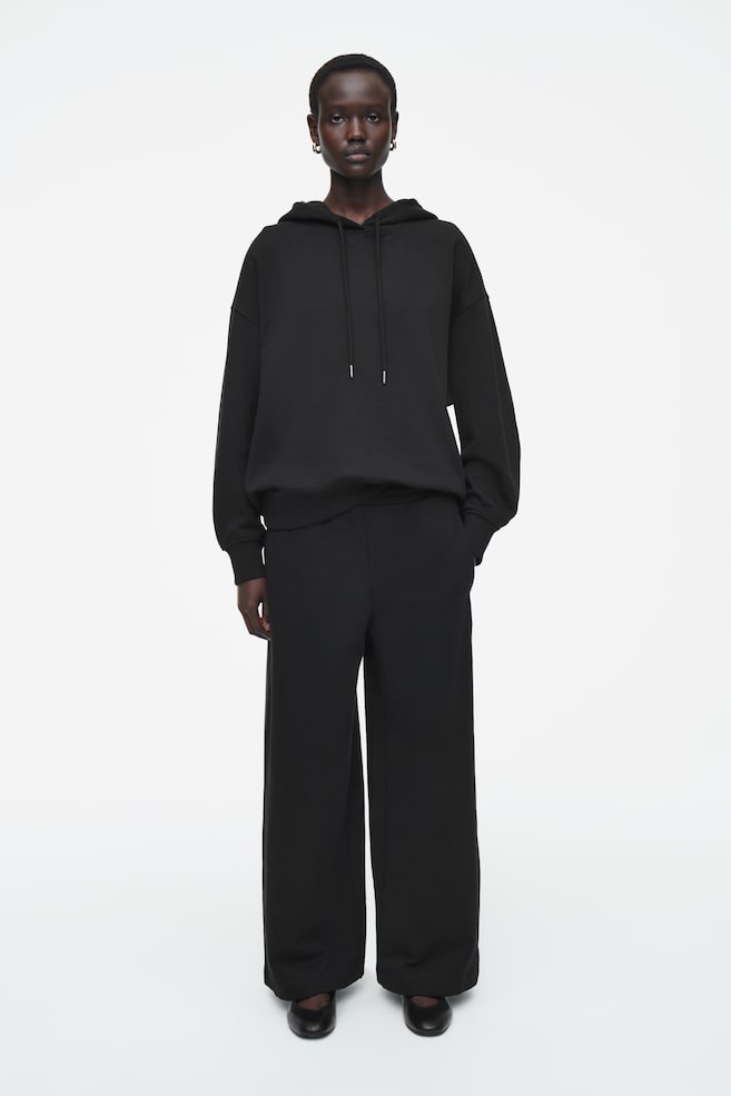 Широкие трикотажные спортивные штаны Cos, черный
Широкие трикотажные спортивные штаны Cos, черный