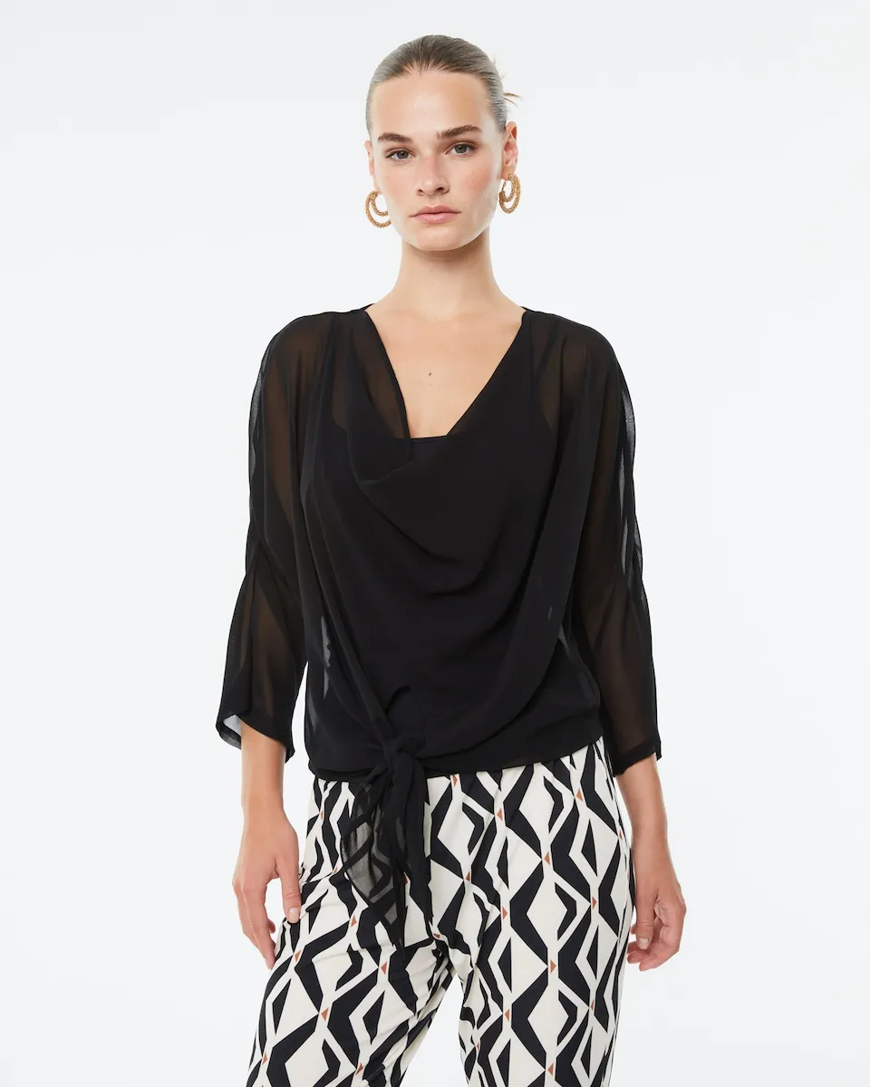 Женский блузон из газа с французским рукавом Paz Torras, черный
Женский блузон из газа с французским рукавом Paz Torras, черный