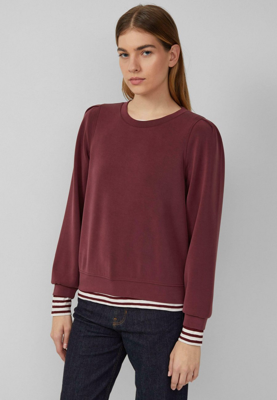 Толстовка s.Oliver MIT PUFFÄRMELN, Bordeaux/Dark Red
Толстовка s.Oliver MIT PUFFÄRMELN, Bordeaux/Dark Red