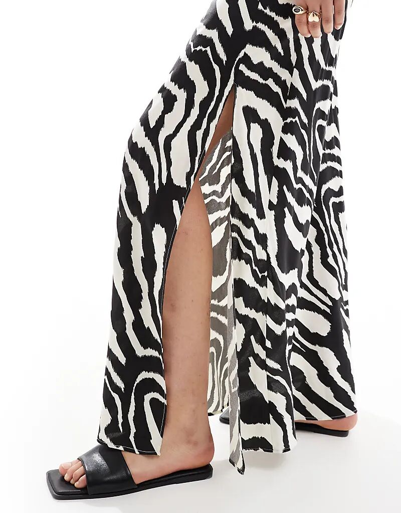 Юбка макси ASOS DESIGN с высоким разрезом и монохромным принтом зебры
Юбка макси ASOS DESIGN с высоким разрезом и монохромным принтом зебры